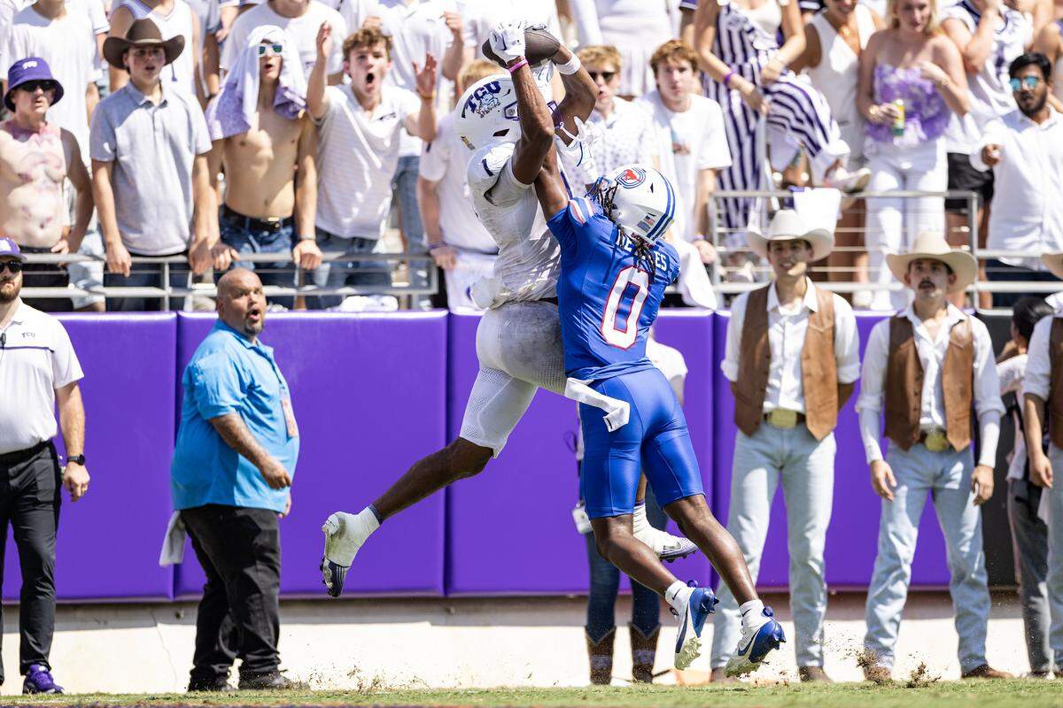 TCU wide receiver Eric McAlister (1) goes up to catch a pass over SMU cornerback William Nettles (0) in the end zone in the second half of an NCAA football game between TCU and SMU at Amon G. Carter Stadium in Fort Worth on Saturday, Sept. 20, 2025. The pass was later deemed incomplete, but TCU won 35-24 in the final Iron Skillet Rivalry game.