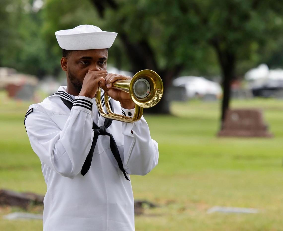 A lone Navy bugler played taps to conclude the 96th Fort Worth Memorial Day Service at Mount Olivet Cemetery in Fort Worth, Texas, Monday, May 26, 2025.
