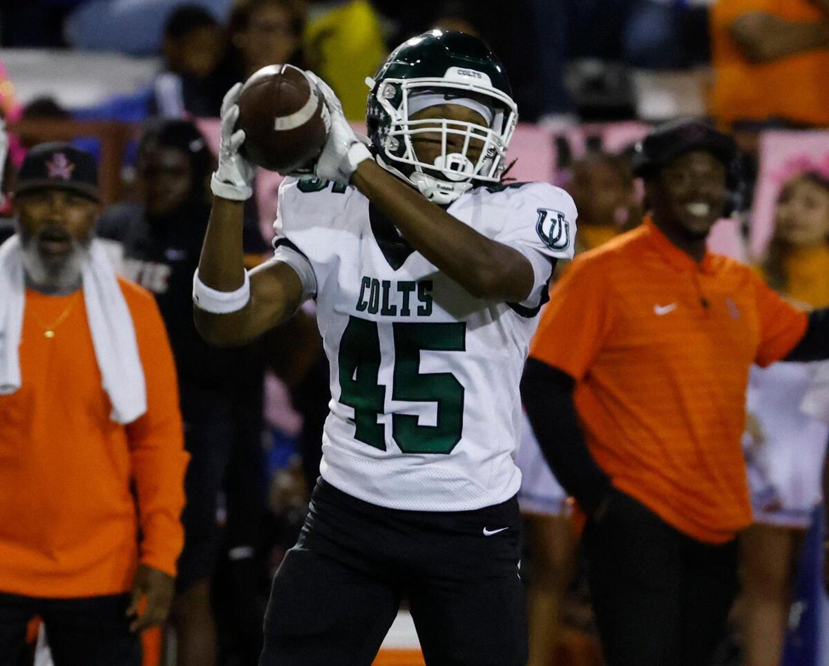 Arlington wide receiver Isaiah Robertson (45) grabs a pass near the Bowie sidelines during a District 8-6A football game at C.H. Wilemon Field in Arlington, Texas, Friday, Oct. 18, 2024.