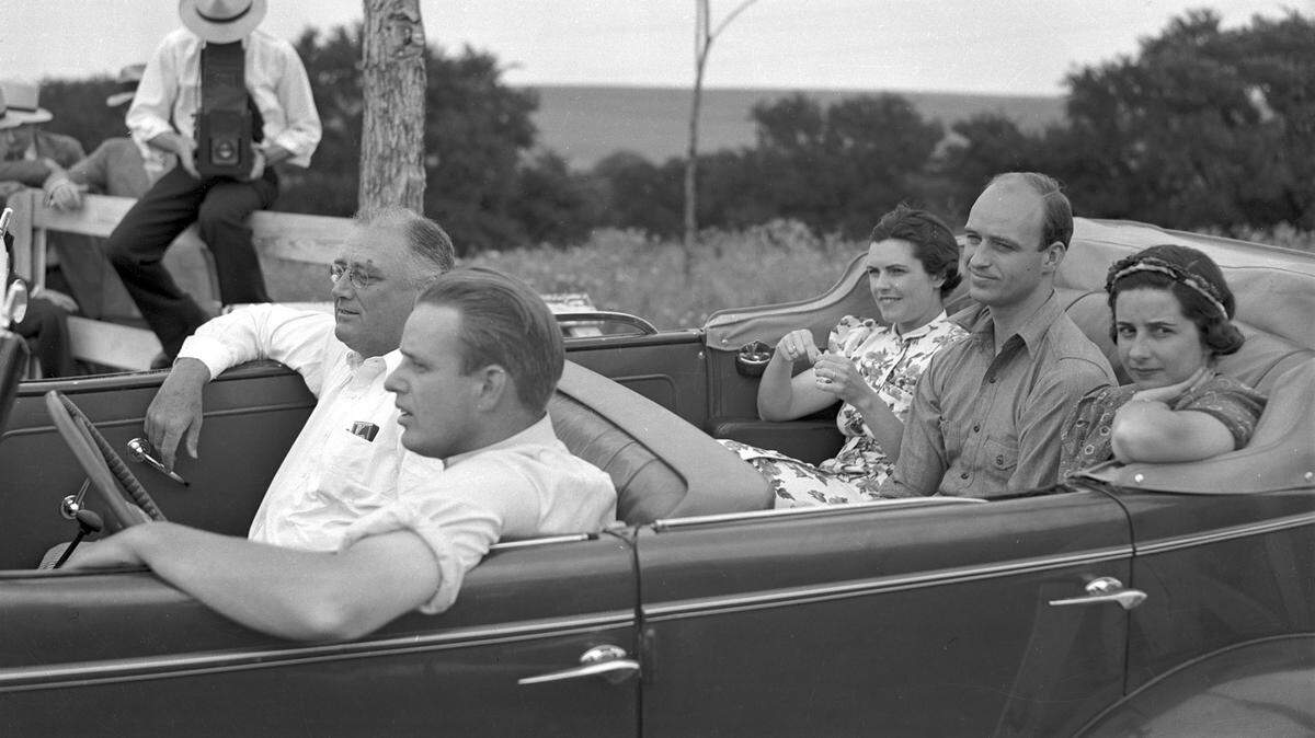Elliott Roosevelt driving his father President Franklin Delano Roosevelt around the Dutch Branch Ranch during a 1937 visit.