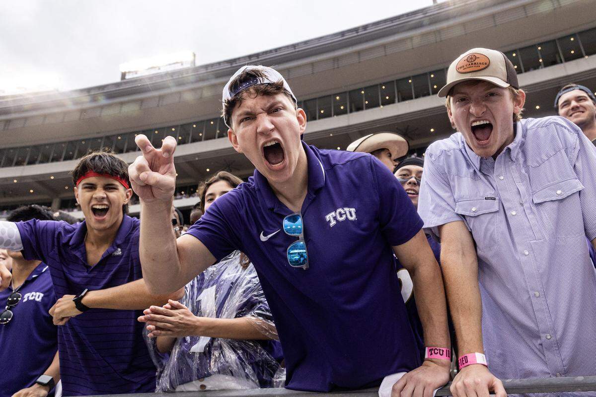 TCU students celebrate after the defense get a stop on fourth down in the second half of a Big XII football game between the TCU Horned Frogs and the Baylor Bears at Amon G Carter Stadium in Fort Worth on Saturday, Oct. 18, 2025.