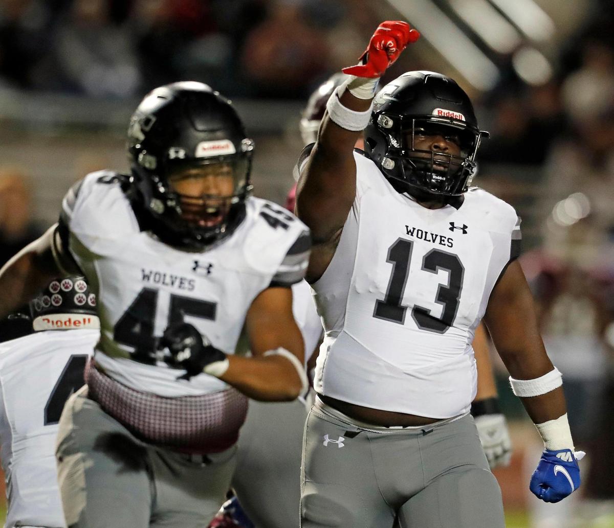 Timberview linebacker Kye Nash (13) celebrates stopping Ennis on a fourth down in a class 5A Division 2 area round football playoff game at Lumpkins Stadium in Waxahachie, Texas, Friday Nov. 19, 2021. Timberview moves on in the playoffs defeating Ennis 42-21. (Special to the Star-Telegram Bob Booth)