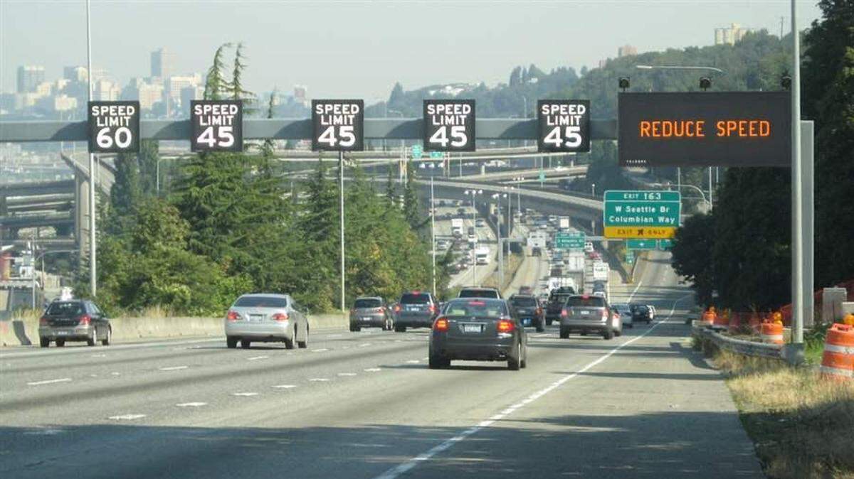 An example of what variable speed limit signs look like above a highway in Washington.