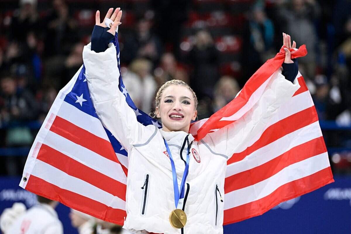 Gold medallist USA' Amber Glenn poses with her medal following the podium ceremony of the figure skating team event during the Milano Cortina 2026 Winter Olympic Games at Milano Ice Skating Arena in Milan on February 8, 2026. (Photo by WANG Zhao / AFP via Getty Images)