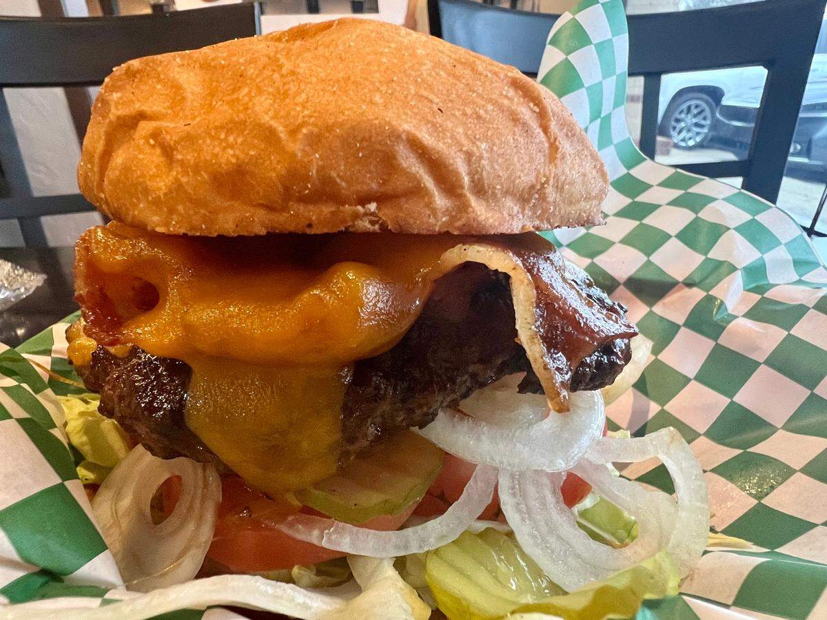 The “Chop House Burger” is a bacon-cheddarburger with a brisket blend and steak sauce.