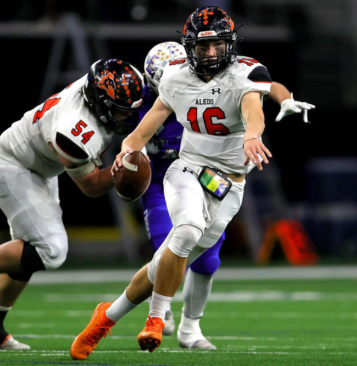 Aledo quarterback Brayden Fowler-Nicolosi (16) scrambles out of the pocket against Frisco during the first half of the 5A Division II Regional round high school football playoffs, December 24, 2020, played at The Ford Center at the Star in Frisco, Tx. (Steve Nurenberg Special to the Star-Telegram)
