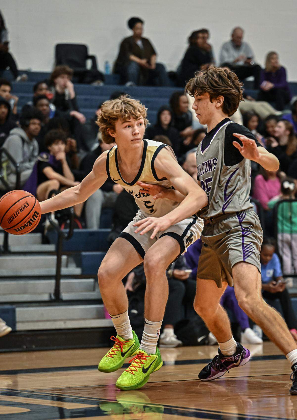 Keller freshman Slade Bradley (5), left, works against a Keller Timber Creek defender in a District 4-6A boys basketball game on Tuesday, January 28, 2025 at Keller High School in Keller, Texas.