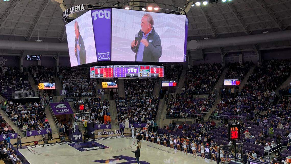 TCU football coach Sonny Dykes addresses the crowd during Saturday’s men’s basketball game against Oklahoma.