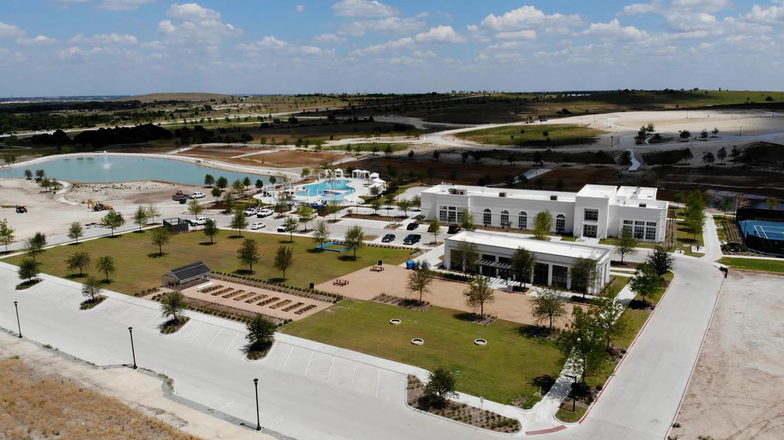 The Community Center at Walsh Development, where work continues in early July. Home builders and road builders alike are working to fill in the empty lots on the 11-square-mile property.