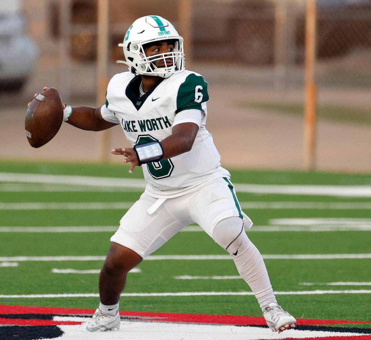 Lake Worth quarterback Jose Meza (6) launches a completion down field in the first half of a UIL football game at Scarborough-Handley Field in Fort Worth, Texas, Thursday, Sept. 28, 2023. Lake Worth led Carter-Riverside 44-13 at the half. (Special to the Star-Telegram Bob Booth)