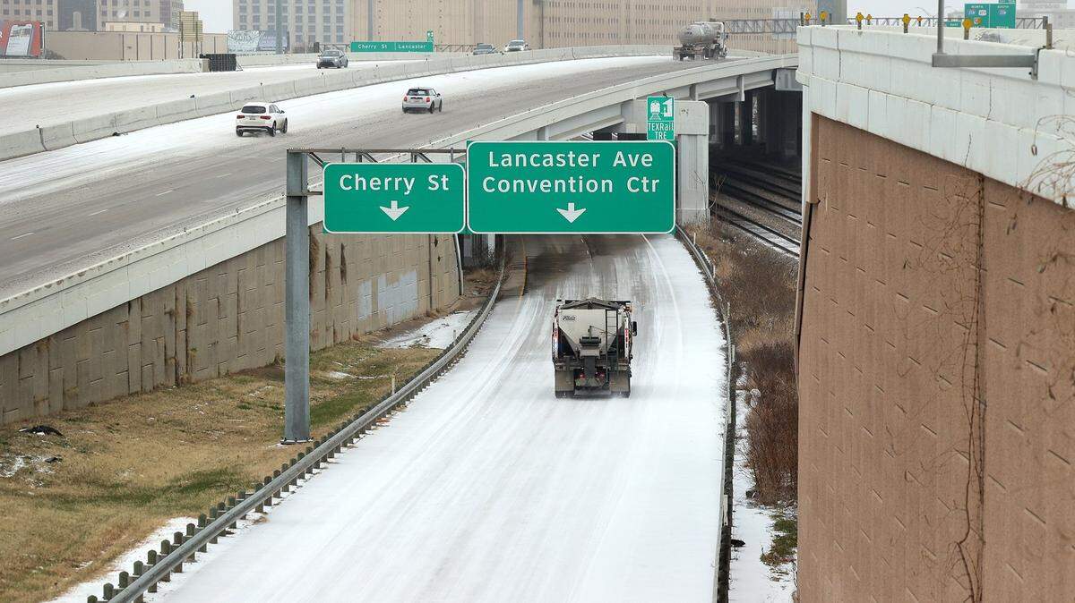 Vehicles drive on a snowy Interstate 30 and its ramps on Tuesday, January 31, 2022. Fort Worth will prioritize high traffic areas during the January 2025 winter storm.