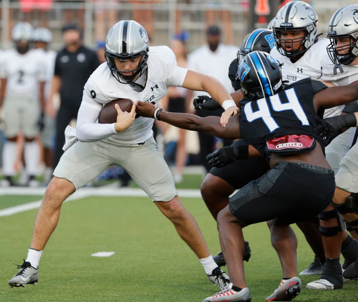 North Crowley linebacker Neutae Cassey (44) grabs Guyer quarterback Kevin Sperry (9) during a UIL football game at Crowley ISD Sports Complex in Fort Worth Friday, Sept. 13, 2024.