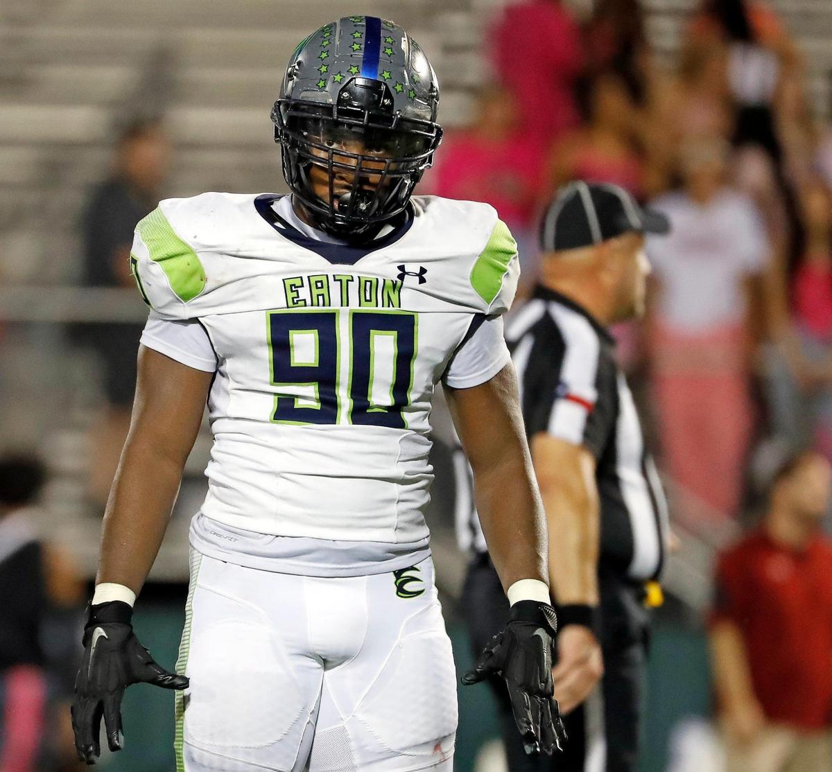Eaton defensive lineman Chancelor Owens (90) glances to the sidelines for the play call in the second half of a District 4-6A high school football game at Keller ISD Stadium in Keller, Texas, Thursday, Oct. 06, 2022. Eaton defeated Keller Central 45-17. (Special to the Star-Telegram Bob Booth)