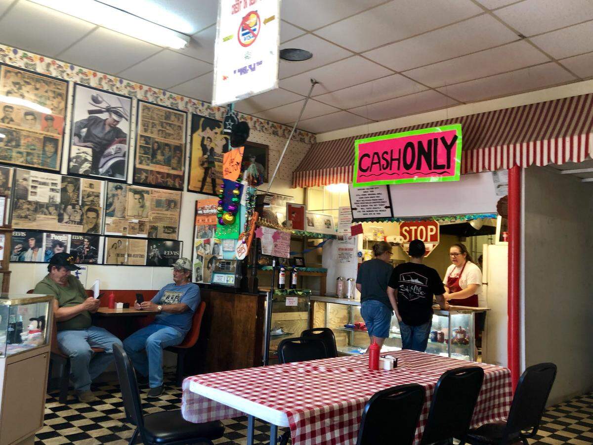 Clown Burger is decorated with old clippings, an Elvis tribute and lots of signs. (Lots.)