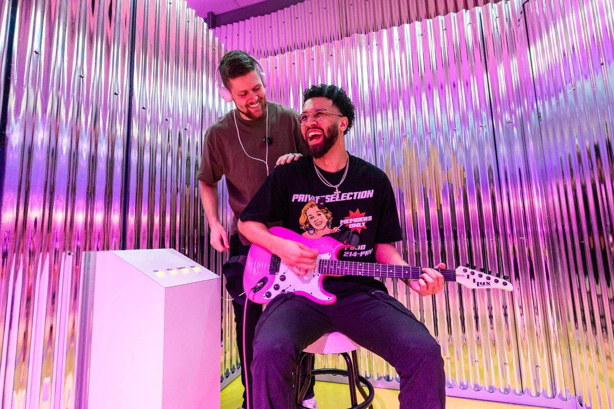 Cameron Kennedy, left, and Peyton Hardin jam out with a guitar in the Music Recording Studio at the ‘World of Barbie’ immersive experience at the Stonebriar Centre in Frisco on Thursday, Nov. 16, 2023.