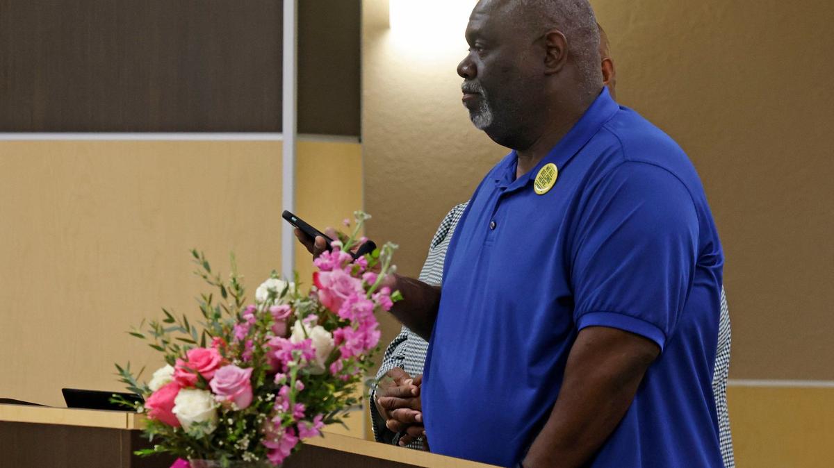 Russell Maryland plays a recording during the Carroll school board meeting Wednesday. Among topics discussed are the recent findings by the Educations Department of violations of student rights.
