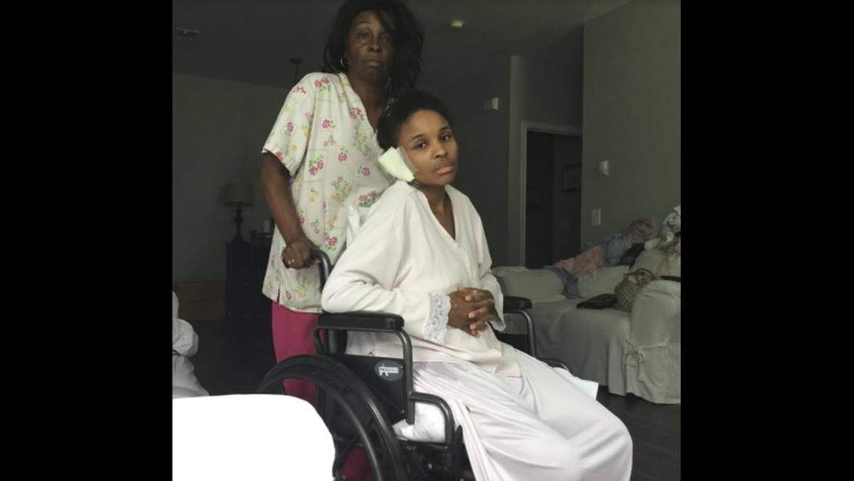 Darlene Brown of Fort Worth is taking care of her daughter, Kisha Johnson, as she recovers after being driven over several times. Johnson's sister has been charged in the attack.