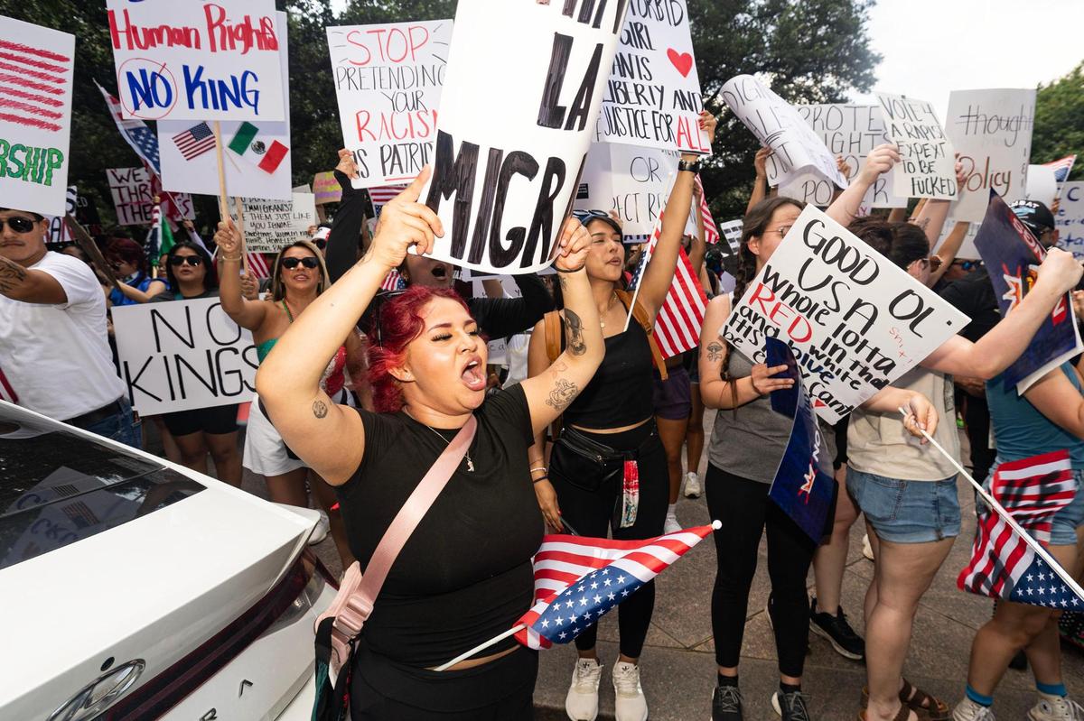 Community members rally during the “No Kings Day” protest in downtown Fort Worth on June 14, 2025.