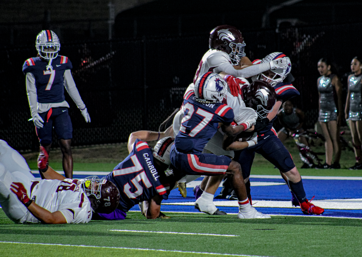 Richland’s Jaylen Gordon (24) and Austin Carroll (75) try to keep a Mansfield Timberview running back out of the end zone on Friday, October 27, 2023 at Birdville Fine Arts/Athletics Complex in North Richland Hills, Texas.