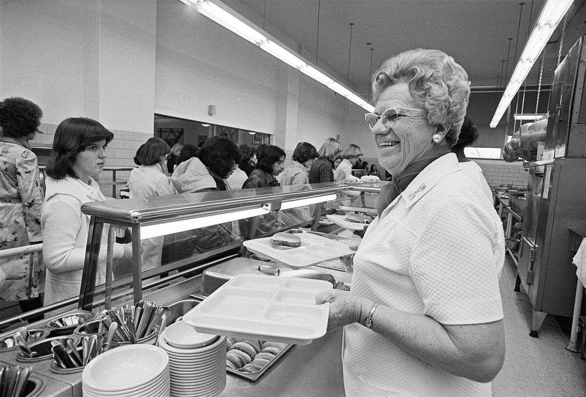 Olga Jaecks working in the Paschal High School cafeteria, serving students at lunch in 1978. 