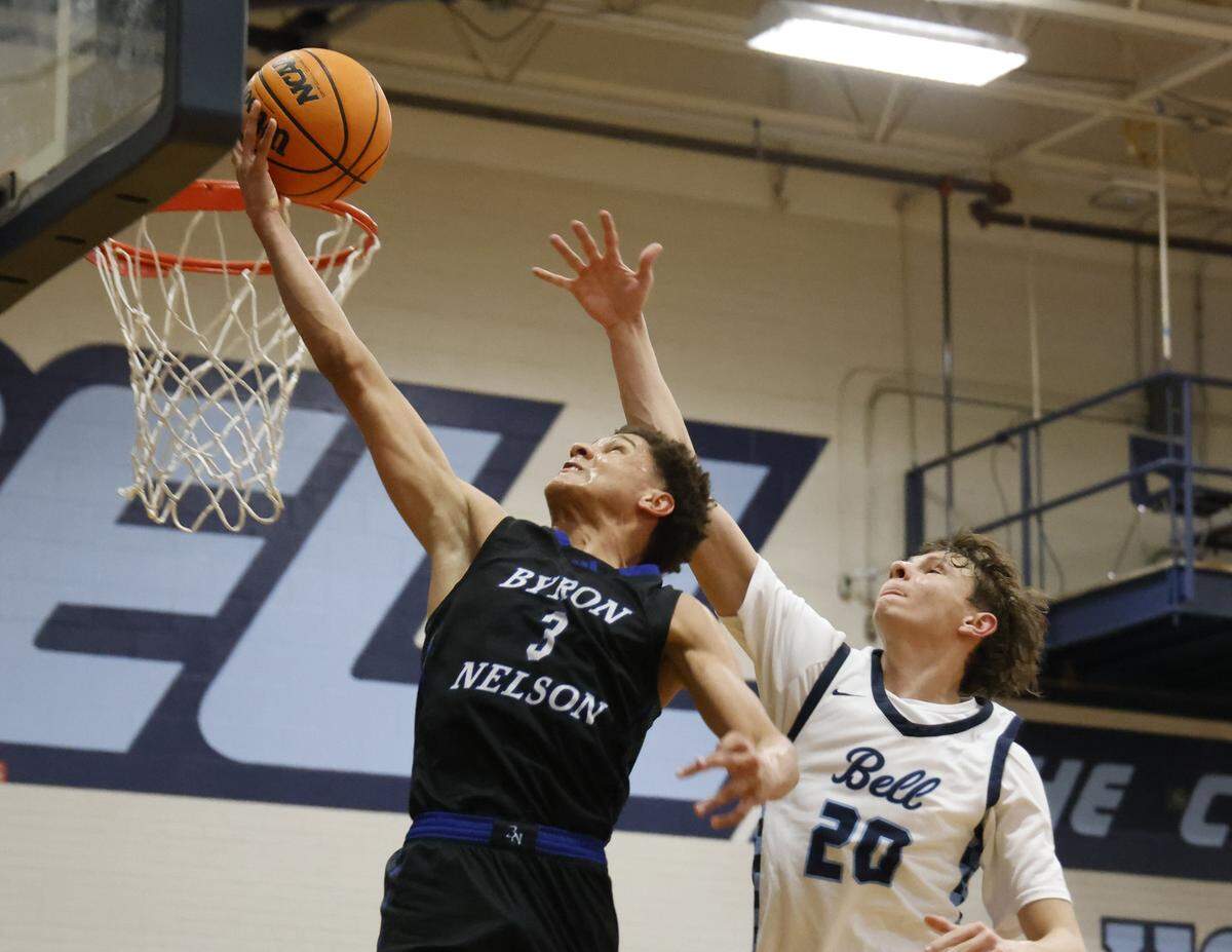 Byron Nelson guard Romejo Waits (3) puts in a soft one ahead of L.D. Bell forward Jesse Mikus (20) during the second half of a boys UIL basketball game between Byron Nelson and L.D. Bell at L.D. Bell High School in Hurst, Texas, Friday Feb. 06, 2026