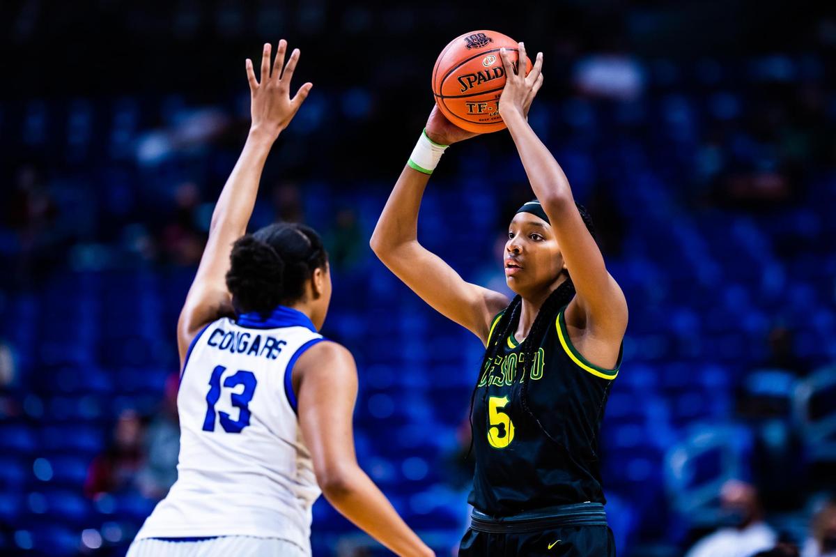 Sa’Myah Smith (5) holds the ball away from the defender during the 6A state final between DeSoto and Cypress Creek at the Alamodome in San Antonio Texas, on March 11, 2021. DeSoto went on to win 53-37. (Photo by Matt Smith. Special to the Star-Telegram).