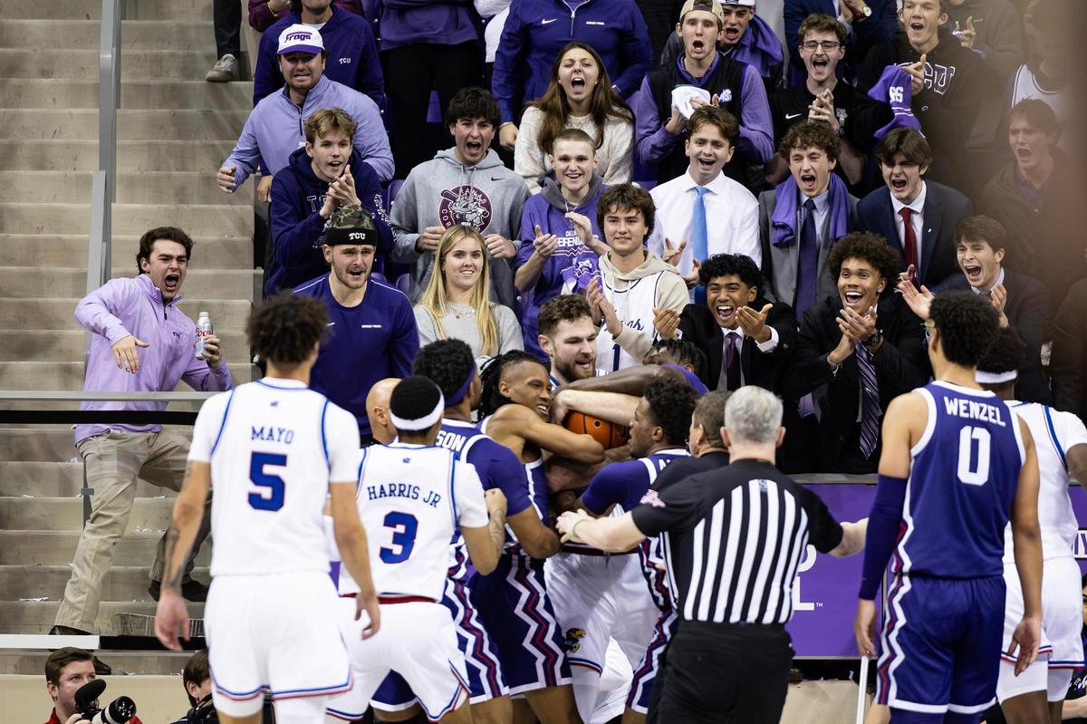 TCU and Kansas players get tied up during a jump ball in the second half of an NCAA game between TCU and Kansas at Schollmaier Arena in Fort Worth on Wednesday, Jan. 22, 2025.