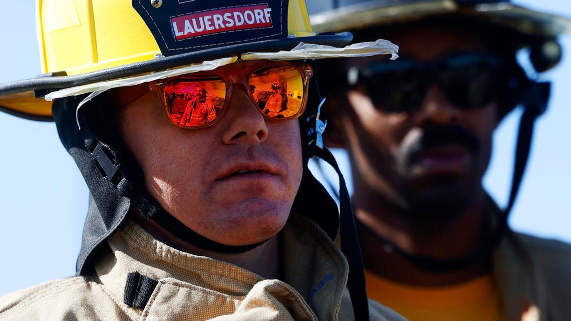 Fort Worth District 4 City Council member Charles Lauersdorf listens as members of the Fort Worth Fire Department explain how they extract victims from car crash vehicles on Friday, April 12, 2024. 