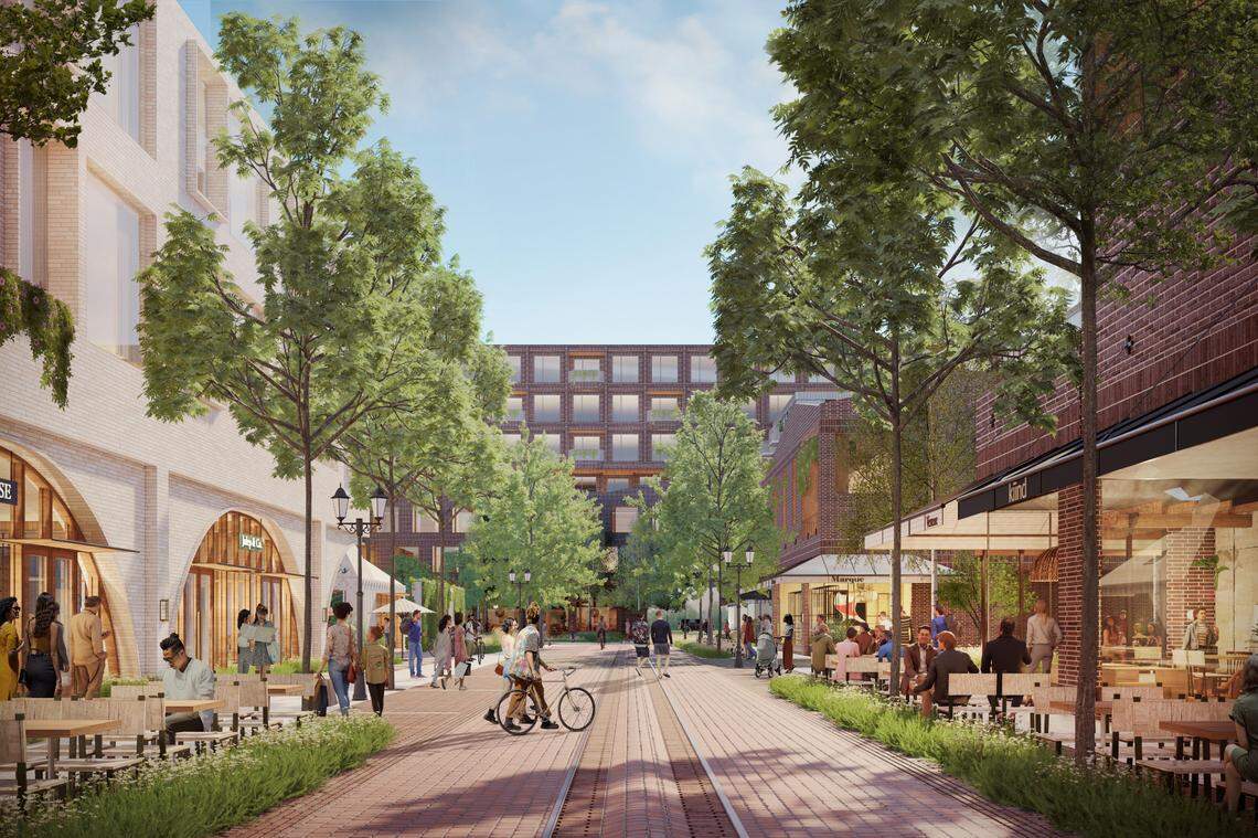 A rendering of the Westside Village development shows a brick path sandwiched by retail buildings and trees.
