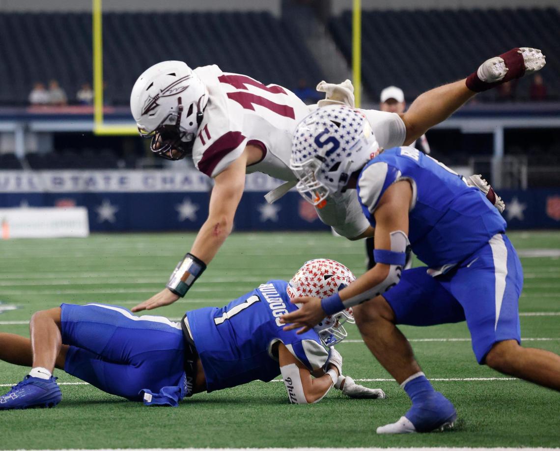 Ganado quarterback Bryce Ullman launches but comes up six inches short of the goal line during the UIL 2A D1 State Championship football game at AT&T Stadium in Arlington, Texas, Thursday, Dec. 19, 2024.