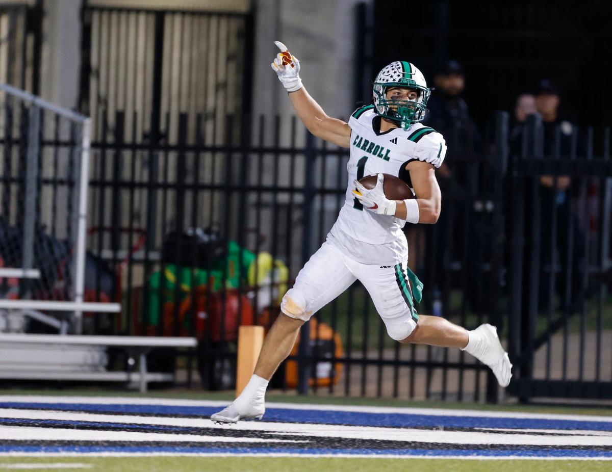 Southlake running back Riley Wormley (1) signals touchdown as he crosses the goal line during a UIL 6A Conference football game at Pennington Field in Bedford Texas, Friday, Sept. 20, 2024.