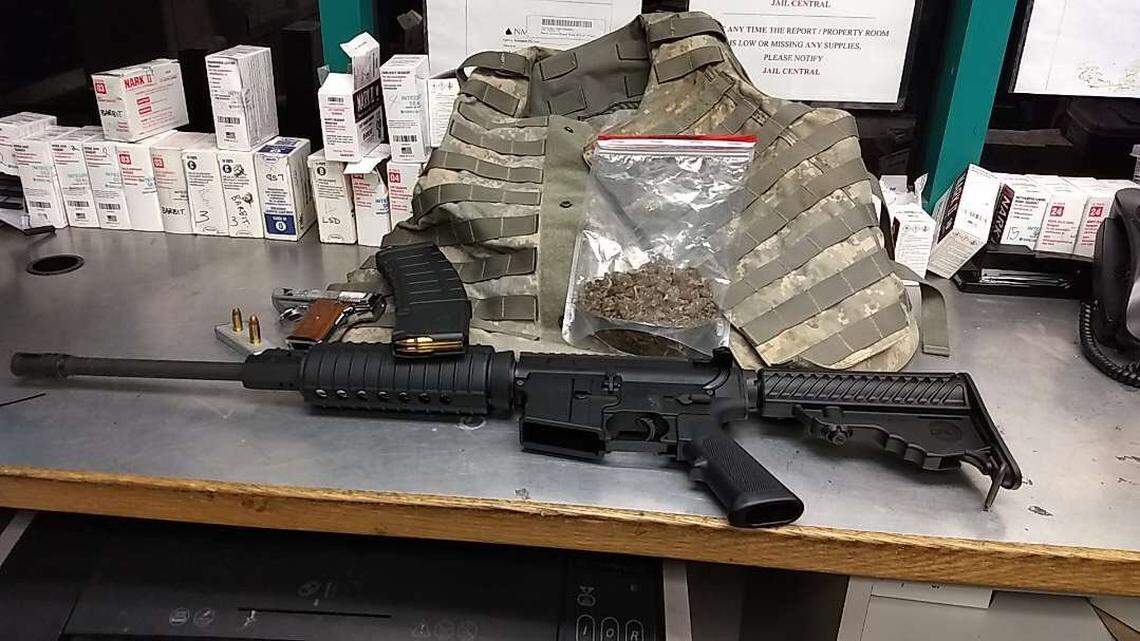 Arlington police seized an AR-15, body armor, a stolen gun and marijuana in a stop at a noisy party.