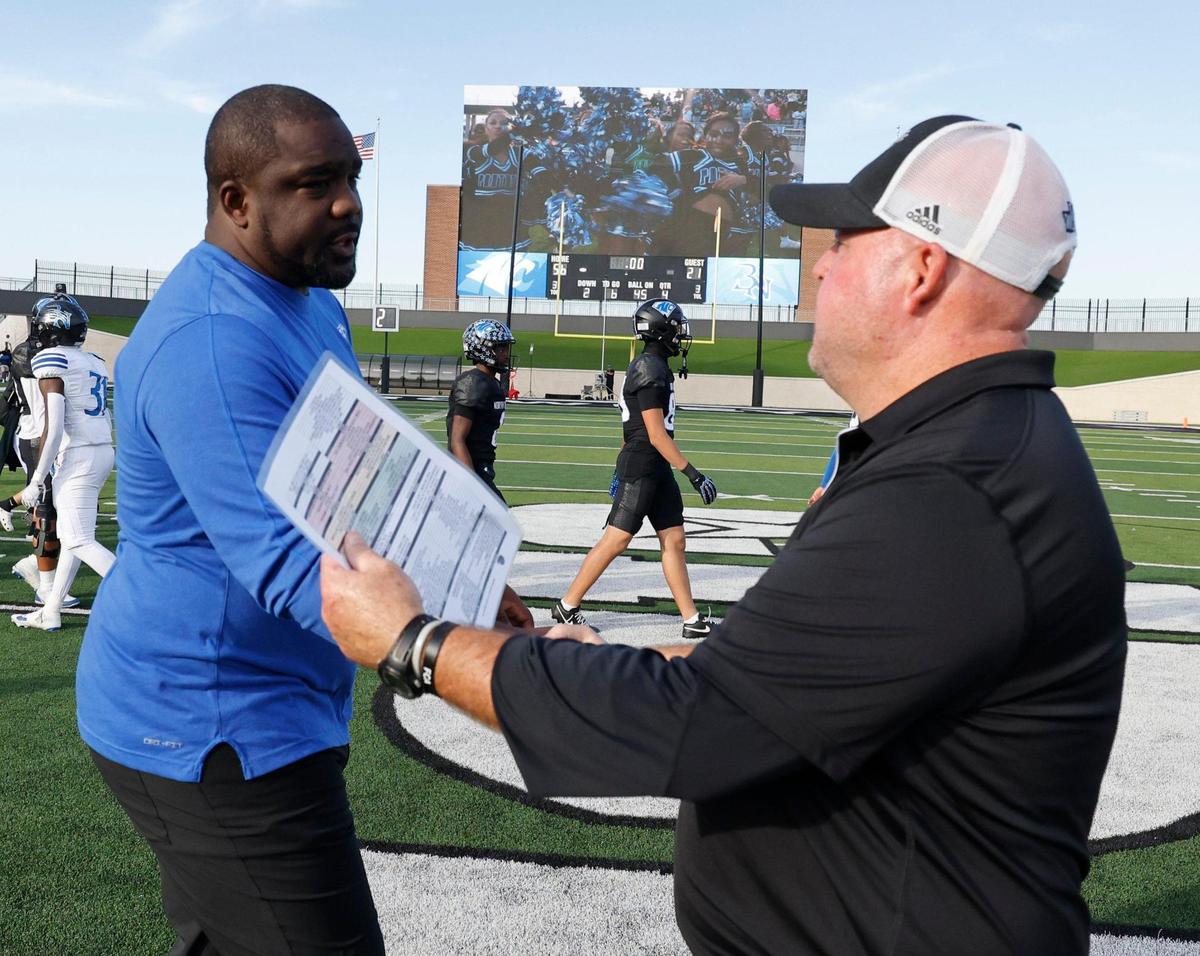 North Crowley head coach Ray Gates and Byron Nelson head coach Travis Pride meet in the middle of the field during a UIL Class 6A D1 Bi-district playoff football game at Crowley ISD Multi-Purpose Stadium in Fort Worth, Texas, Saturday, Nov. 16, 2024.