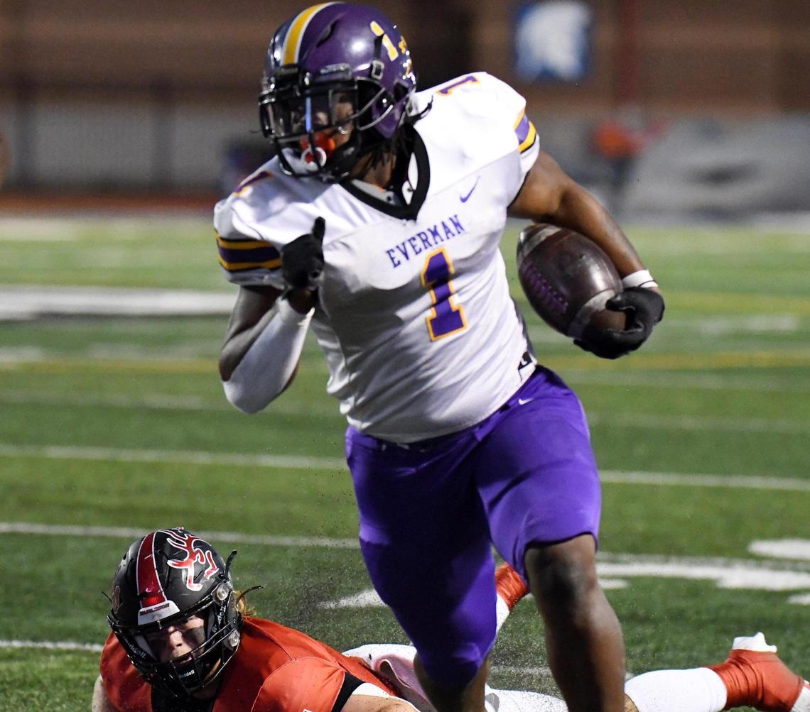 Everman’s Errick Mills, left runs past Burleson’s Kyndall Cassidy for a first down in the first quarter of Thursday’s October 13, 2022 District 5-5A Division 2 football game at Burleson ISD Stadium in Burleson, Texas. Special/Bob Haynes