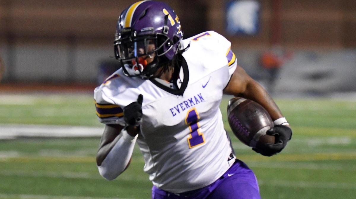 Everman’s Errick Mills, left runs past Burleson’s Kyndall Cassidy for a first down in the first quarter of Thursday’s October 13, 2022 District 5-5A Division 2 football game at Burleson ISD Stadium in Burleson, Texas. Special/Bob Haynes