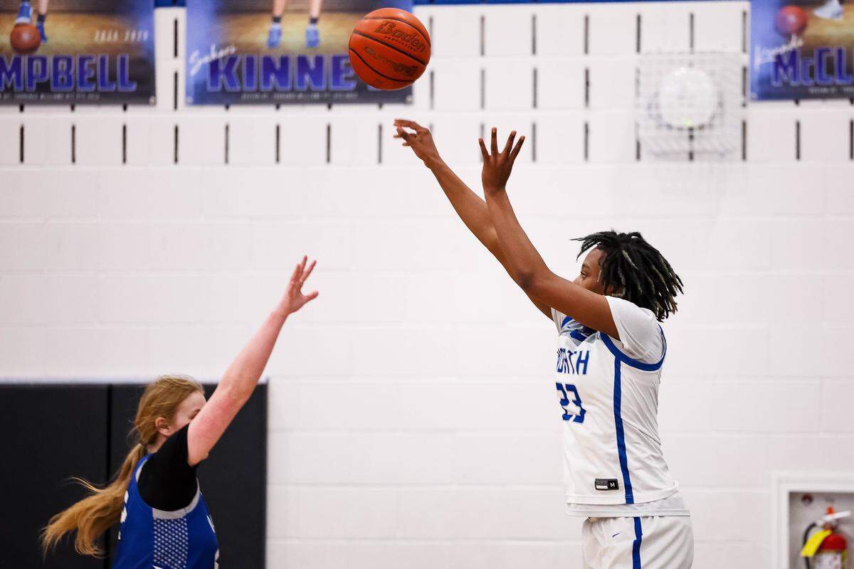 North Crowley forward Mecca Crawford shoots a 3-pointer over a Weatherford defender during a District 3-6A matchup Friday at North Crowley.