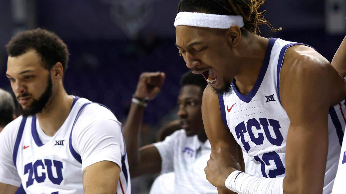TCU forwards Xavier Cork (12) and JaKobe Coles, left, react after TCU scored a 3-pointer against Louisiana-Monroe during the second half of an NCAA college basketball game Thursday, Nov. 17, 2022, in Fort Worth, Texas. TCU downed California on Friday night to advance to the championship game of the Emerald Coast Classic. (AP Photo/Ron Jenkins)