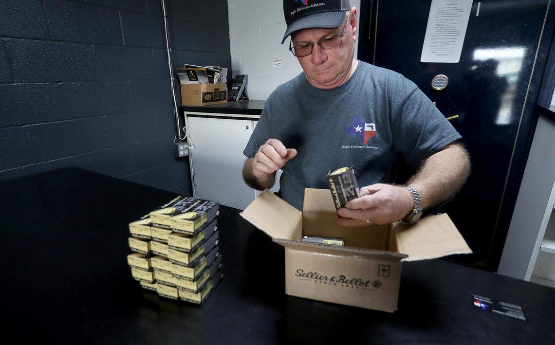 Curtis Van Liew, owner of Eagle Defense Solutions, stacks boxes of 9mm ammo that he purchased as backup for his Texas License to Carry class. Van Liew said coronavirus fear is causing ammo to be difficult to find. He had to go to four different stores over the weekend to stock up on ammo.