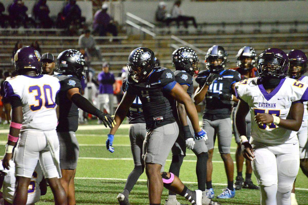 Mansfield Summit defensive lineman Travis Buhake (center) celebrates after a play against Everman on Thursday, Oct. 31, 2024 at Newsom Stadium in Mansfield, Texas.