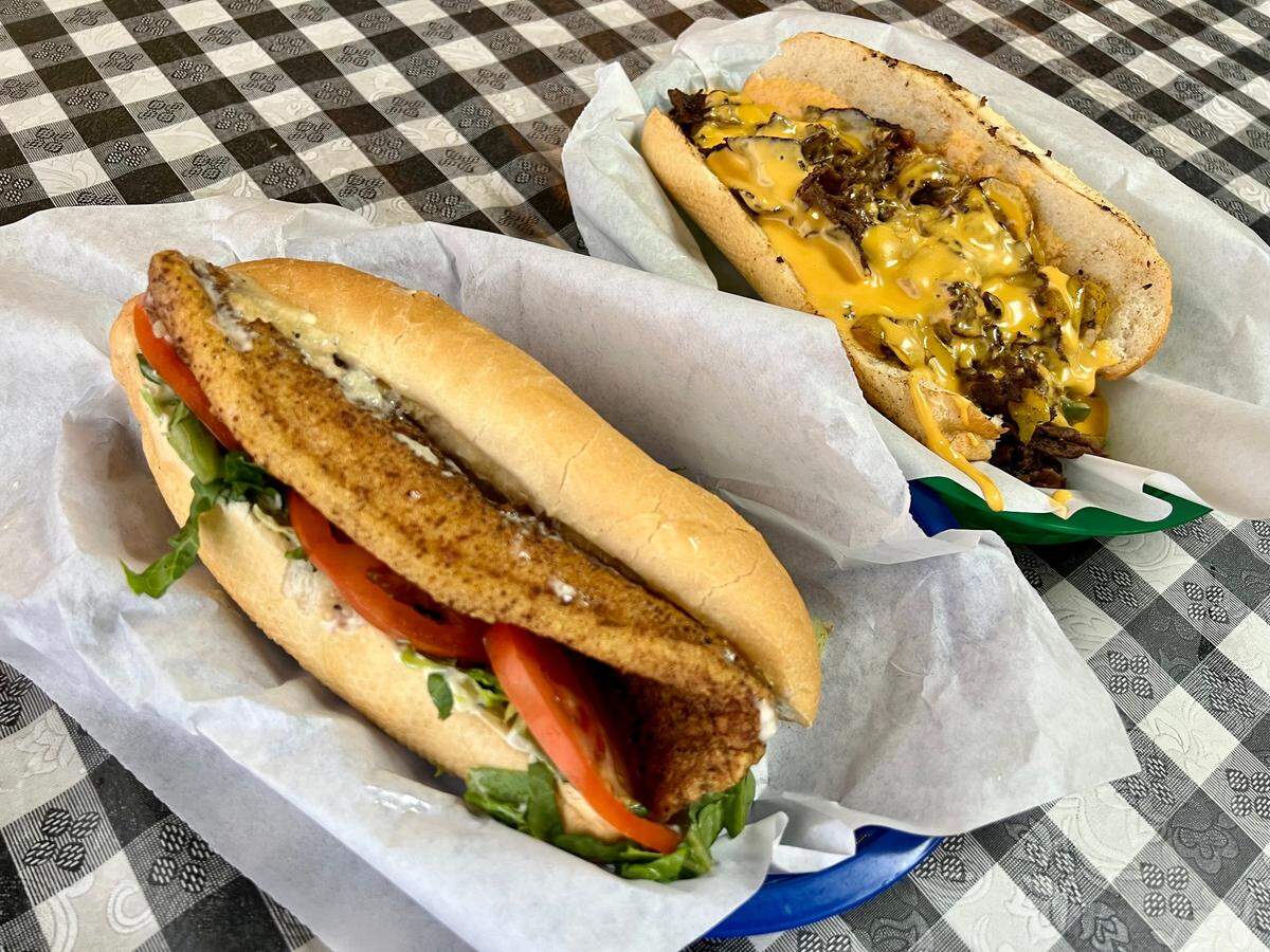 A catfish sandwich and a Philly cheesesteak with Cheez Whiz at Burger & Philly Shack in Watauga.