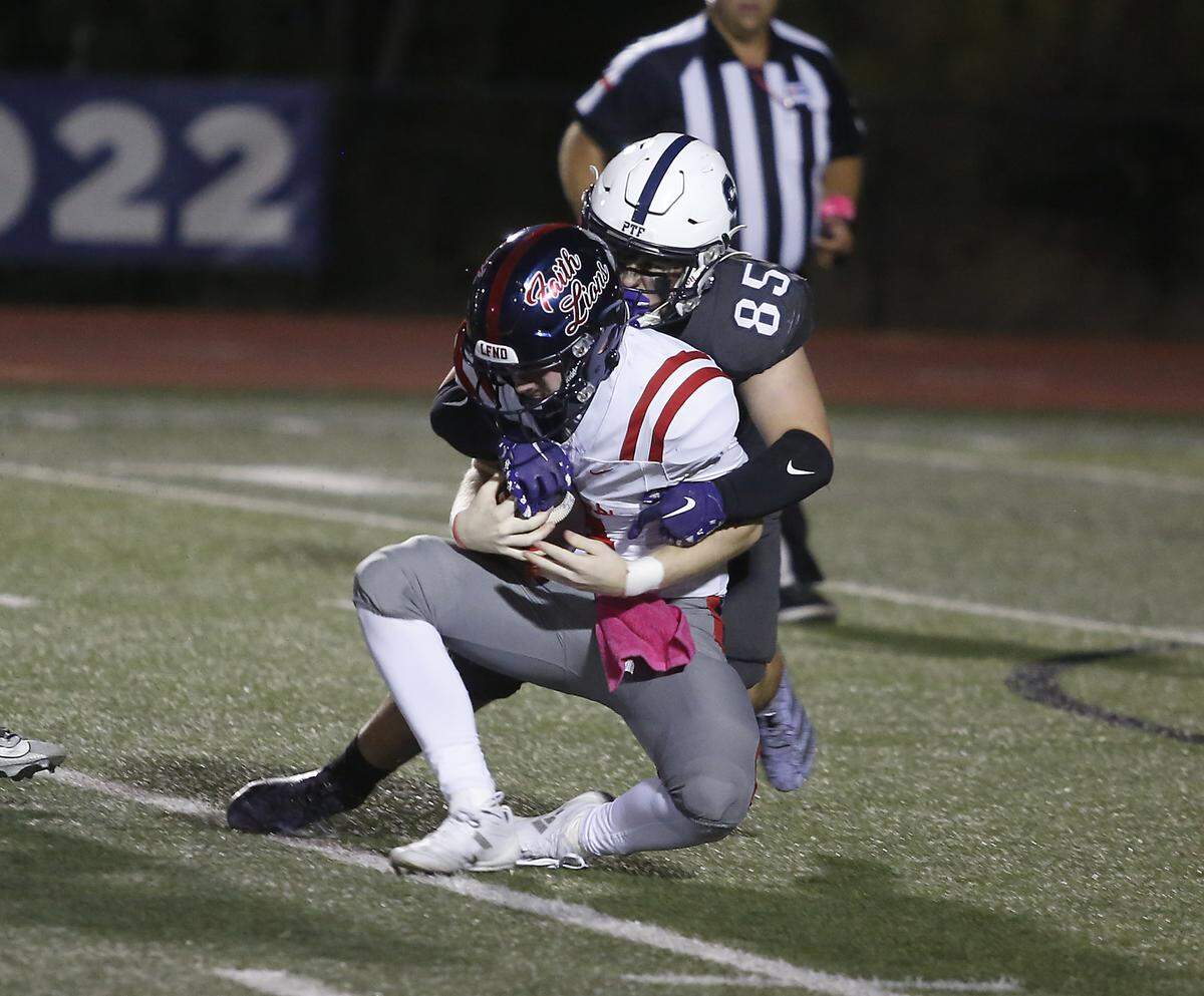All Saints Episcopal’s Parker Robert sacks against Grapevine Faith’s Austin Cosby during their game at All Saints Episcopal on Friday, Oct. 10, 2025.