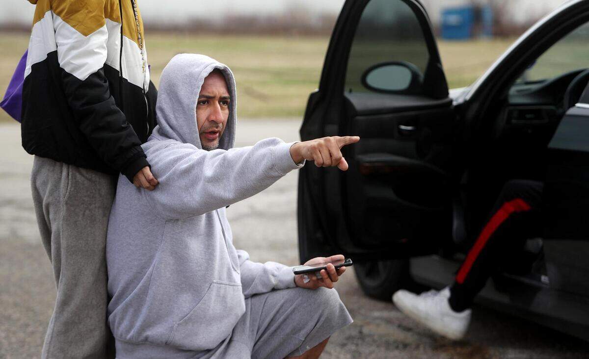 Gerardo Reyes, uncle of Jose Reyes, directs volunteers on where to search along the shore of Benbrook Lake on Thursday, March 25, 2021. Jose Reyes went missing Sunday evening while kayaking on the lake. Family members are frustrated by what they see as a limited response by authorities to search for Reyes.