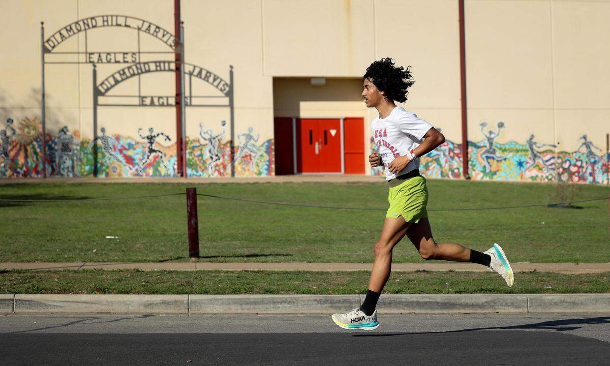 Diamond Hill-Jarvis High School senior Angel Sanchez runs around the school on Wednesday, November 8, 2023, in Fort Worth. Sanchez has won back to back Class 4A Cross Country State Championships.