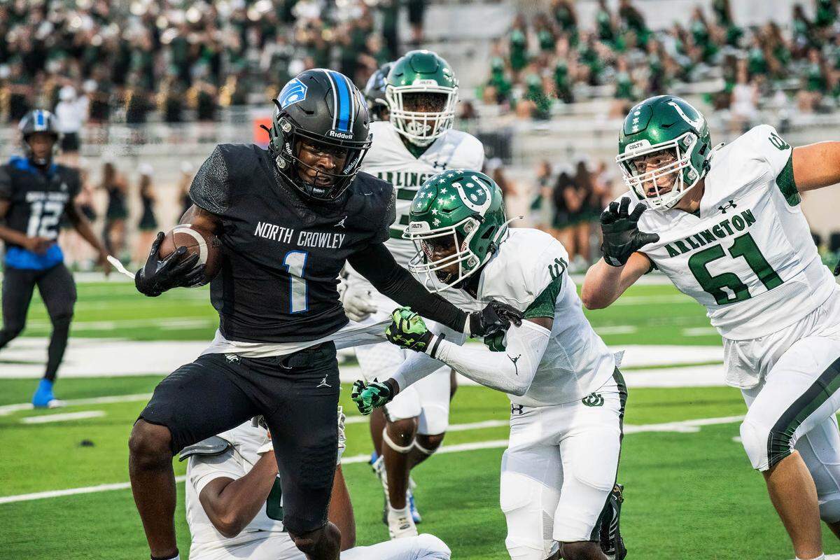 North Crowley running back Cornelius Warren III fights for yardage against Arlington High on Friday September 1, 2023 at Crowley IDS Stadium in Fort Worth, Texas.