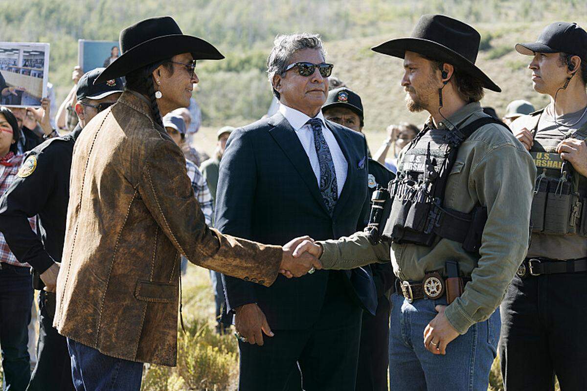 "Piya Wiconi" -- Kayce Dutton reunites with an old SEAL teammate and aids his Marshal unit in hunting down a bomber targeting Broken Rock Reservation. The trail leads to a dangerous encounter with an armed anti-government militia on the series premiere of “Marshals,” Sunday, March 1 (8:00-9:00 PM, ET/PT). Pictured (L-R): Mo Brings Plenty, Gil Birmingham as Thomas Rainwater, and, Luke Grimes as Kayce Dutton.