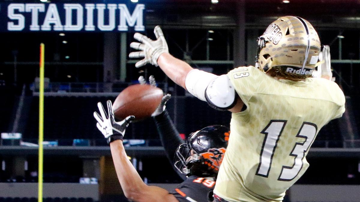 Aledo defensive back Tre Owens (19) steps in front of Wichita Falls Rider tight end Kyler Spear (13) in the end zone for a pick six in the first half of a high school Class 5A Division II State Semifinals football playoff game at AT&T Stadium, Arlington, Texas, Friday, Dec. 14, 2018. Aledo led 42-0 at the half. (Star-Telegram Bob Booth)