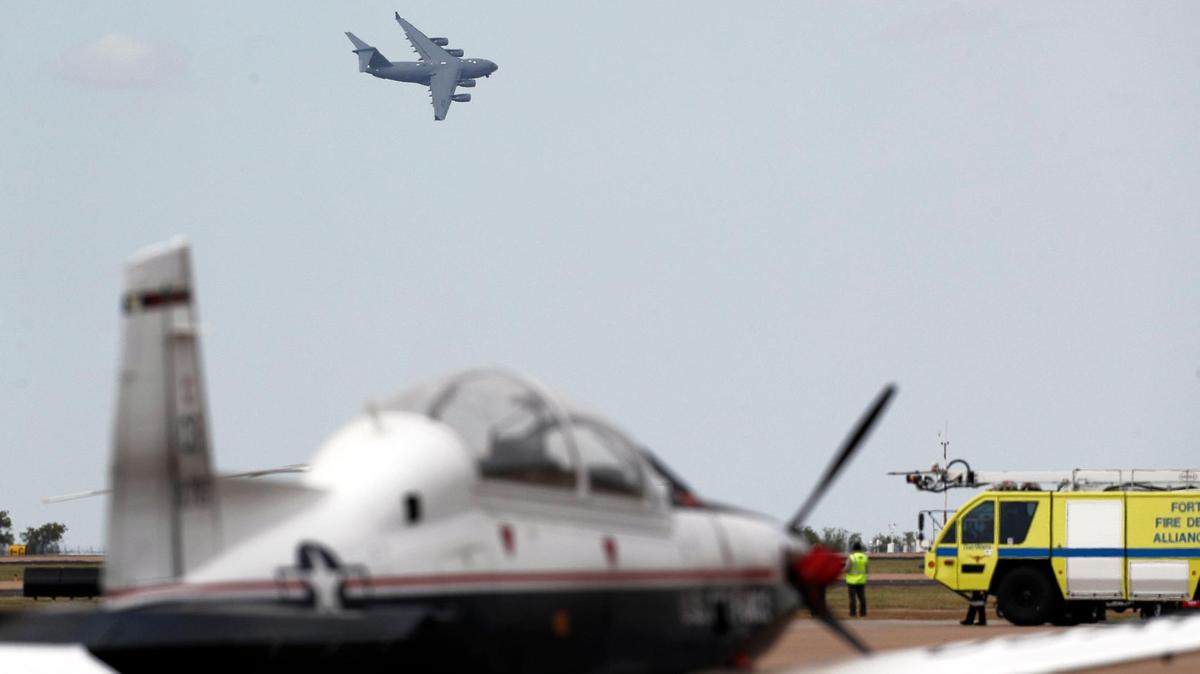A massive C-17 does a fly over during the Bell Fort Worth Alliance Air Show at Alliance Airport in Fort Worth, Texas, Saturday, Oct. 17, 2020. In it’s 30th year the Alliance Air Show is billed as the 1st. Drive-in Air Show due to Covid-19. In the history of the air show they have never cancelled a weekend. There have been a couple of days cancelled due to inclement weather. Spectators viewed the show from their vehicles in the parking area. The sold out show sold more than 6000 parking spaces. The spaces which were the equivalent of three normal spaces allowed for social distancing. Spectators brought chairs, swings and anything else to make their experience more comfortable. (Special to the Star-Telegram Bob Booth)