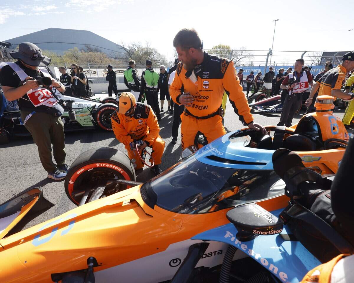 The crew of Nolan Siegel (6) prepares his car on pit row before the inaugural Java House Grand Prix of Arlington in Arlington, Texas, Sunday, March, 15, 2026.