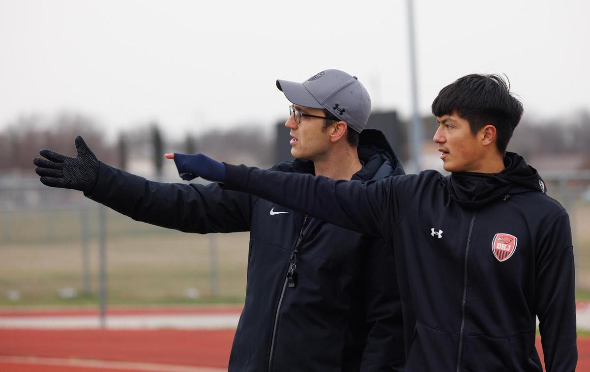 Diamond Hill-Jarvis coach Kyle Reopelle talks over strategy for a corner kick with Joshua Montanez during practice with teammates on Thursday, Feb. 13, 2025, in Fort Worth.