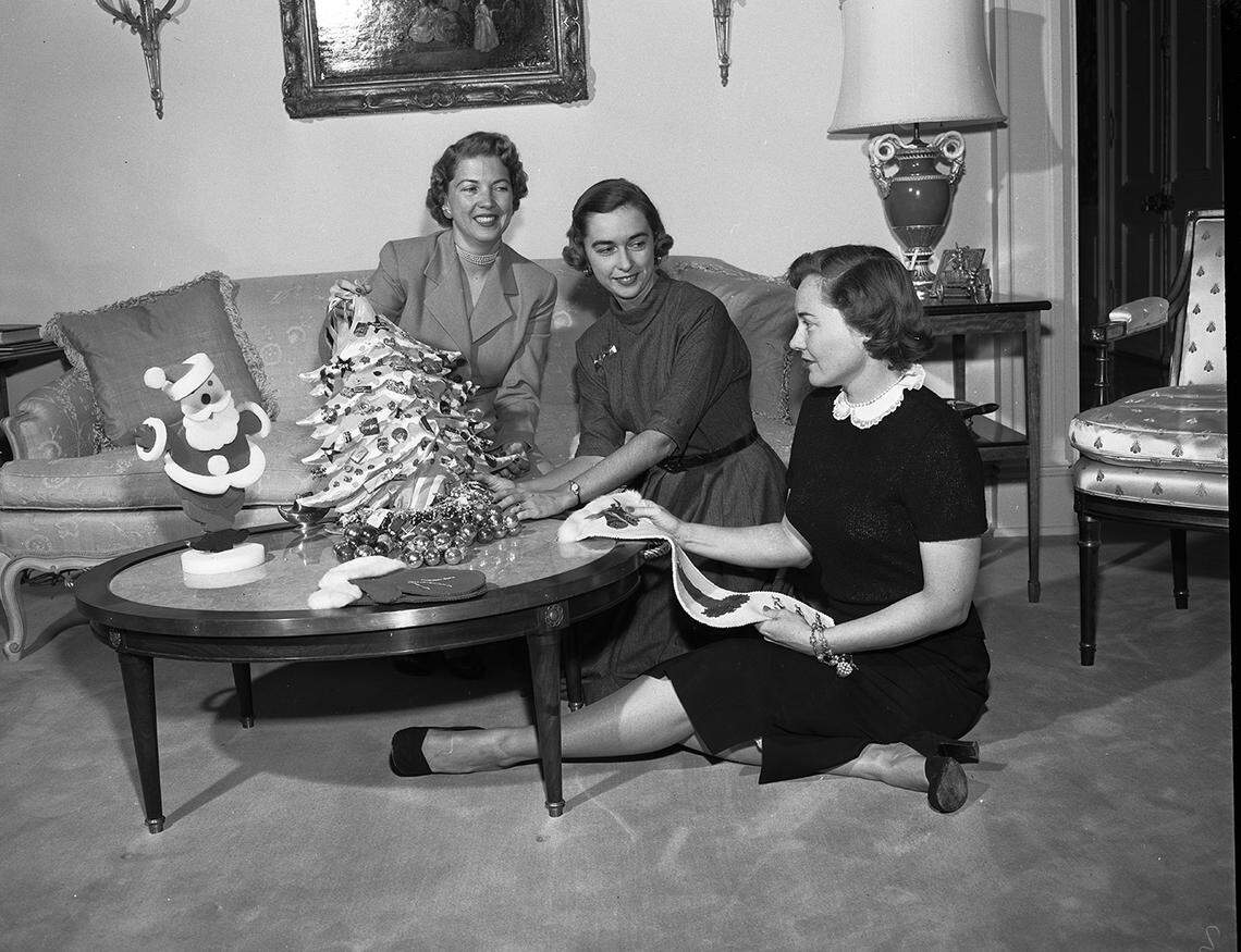 Nov. 12, 1952: From a series on holiday decoration. Coffee table decorations with Mmes. Richard C. Newkirk Jr., William W. Collins and W.H. Slay Jr.